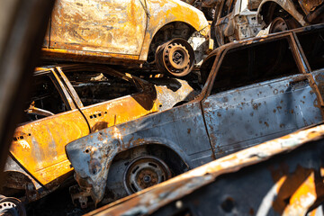 Cemetery of burnt rusty cars.