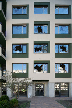 House with broken windows from a shell explosion.
