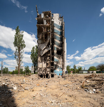Facade of a bombed-out apartment building.