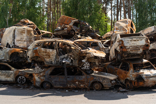 Cemetery of burnt rusty cars.