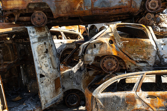 Cemetery of burnt rusty cars.