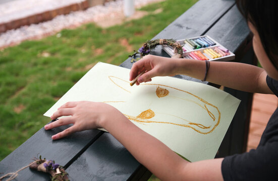 Asian little girl is drawing about horse