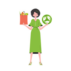 The girl is depicted in full growth and holds a bag of healthy food in her hands and shows the EKO icon. Isolated on white background. Trend style, vector illustration. - obrazy, fototapety, plakaty
