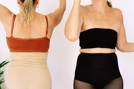 Crop mature women in lingerie dancing 