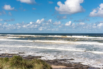 Beach view in Byron Bay, Australia on blue sky day. 