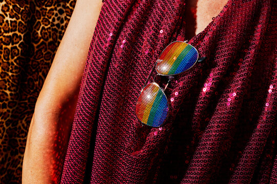 has a pair of rainbow-patterned sunglasses
