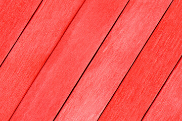 Beautiful wooden boards in red color. Textured background made from red boards. The wooden planks...