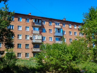 Fototapeta na wymiar Soviet apartment building. Apartment block. Soviet architecture. Ust-Kamenogorsk (Kazakhstan)