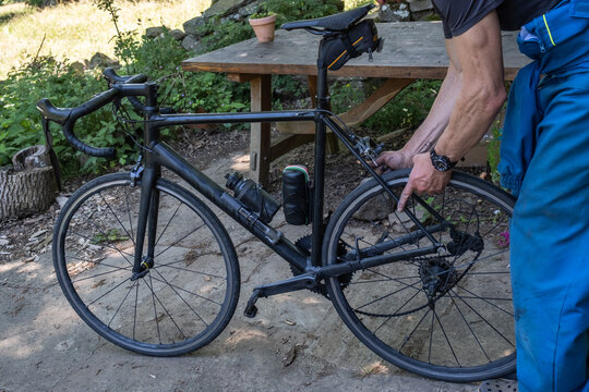 bicycle maintenance: placing the back wheel on the bike