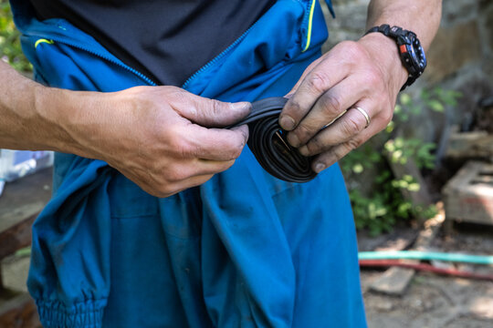 rolling up an inner tube of a bicycle tire
