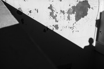 A human shadow on the wall.