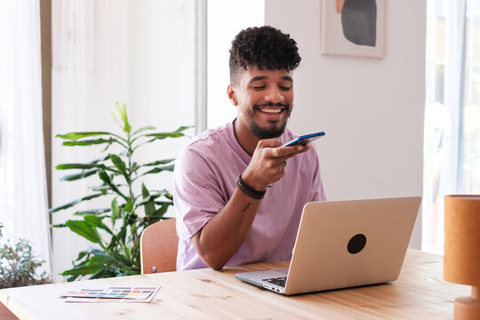 Man sending audio message with phone