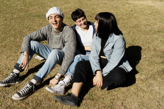 Group Of Gen Z Friends In Park On Grass