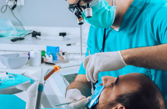 Dental Surgeon and patient during surgical intervention