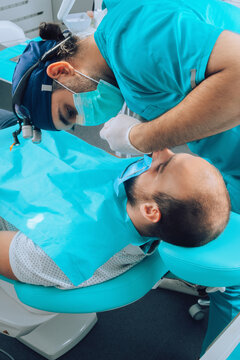 Dental Surgeon and patient during surgical intervention