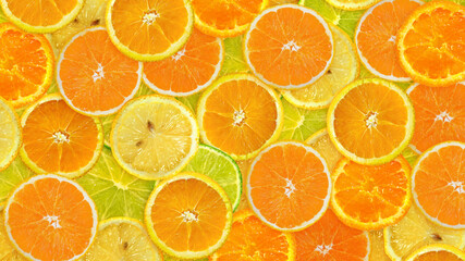 Fresh sliced mixed citrus fruits background. Concept of healthy eating, dieting. Top view