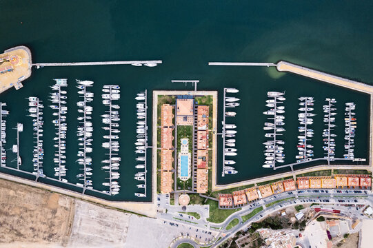 Boats moored in port near residential district