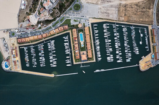 Modern port with moored yachts in coastal town