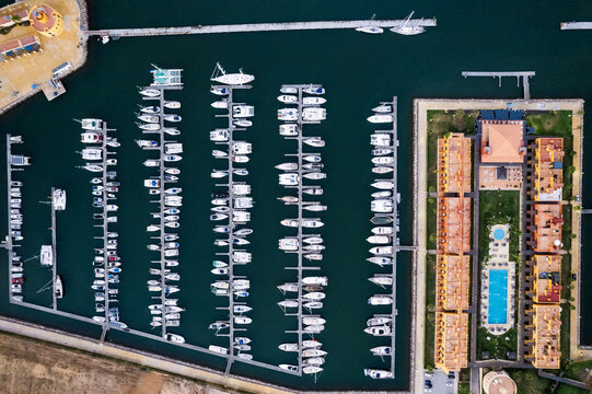 Boats moored in port near residential district