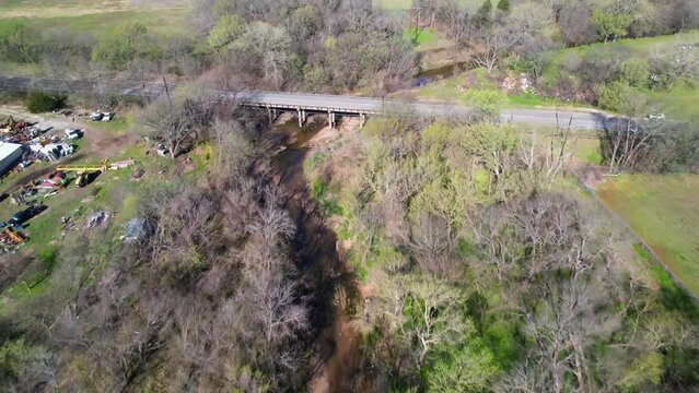 Aerial footage of Post Oak Creek in Sherman Texas.  Drone is flying approximately west over the creek.