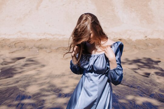Anonymous Woman in beautiful blue silk dress