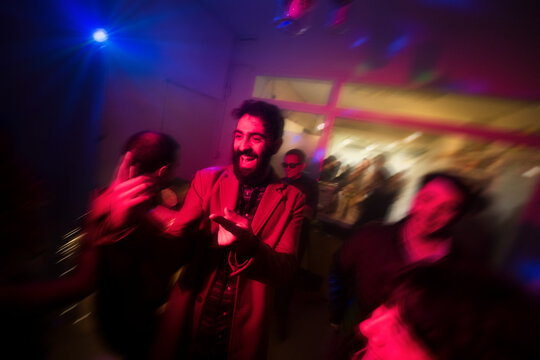 Cheerful man dancing at the party