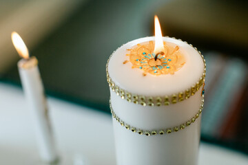 Closeup of Lit, Decorated Candle