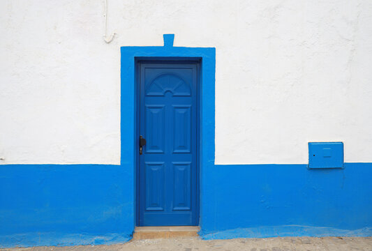 blue door in blue and white wall