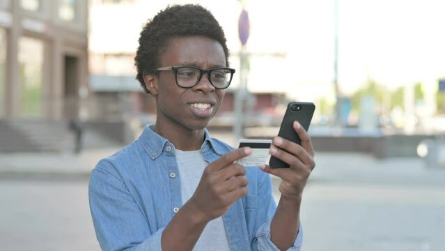 Upset Young African Man Reacting to Fail Online Shopping, Outdoor