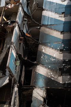 Facade of a bombed-out apartment building.
