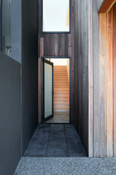 Entrance to townhouse with timber staircase