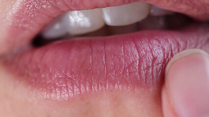 Extreme close up shot of the mouth of a Woman. Slow motion. natural lips. soft focus