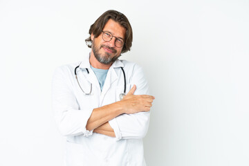 Fototapeta premium Senior dutch man isolated on white background wearing a doctor gown and pointing side