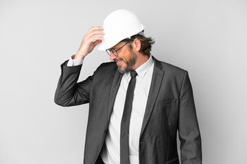 Young architect man with helmet over isolated background laughing