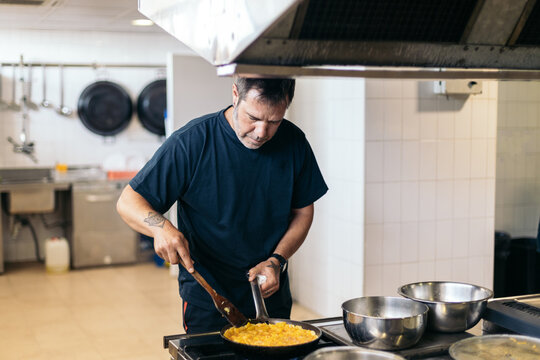 A day with the fire department. Firefighter preparing breakfast.