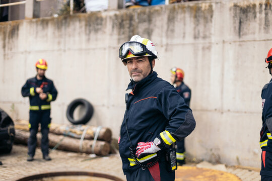 Firefighters working in a parking lot
