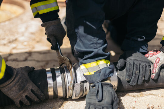 Tight shot of firefighters working