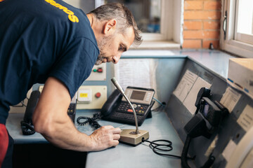 Firefighter using the radio to make a statement