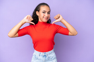 Young woman isolated on purple background proud and self-satisfied