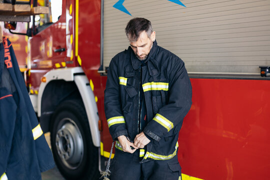 Firefighters putting on uniform