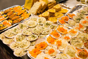 Grilled Scallops shell with butter and garlic, focus selective