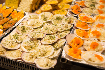 Grilled Scallops shell with butter and garlic, focus selective