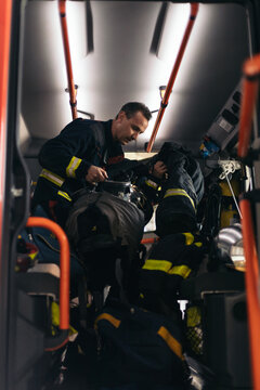 Firefighters getting off the fire truck