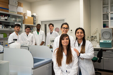 Group Portrait Of Scientists In The Laboratory.