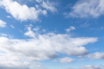 Naklejka na ściany i meble Blue sky with white clouds . Heaven in the summer 