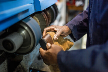 anonymous hands of black man cobbler fixing some shoes