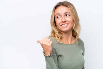 Young Russian woman isolated on white background pointing to the side to present a product