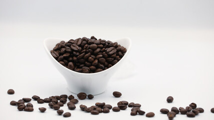 Coffee Beans in Coffee Cup on White Background