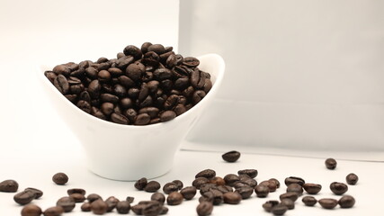 Coffee Beans in Coffee Cup on White Background