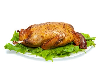 Roast duck on a plate isolated on a white background
